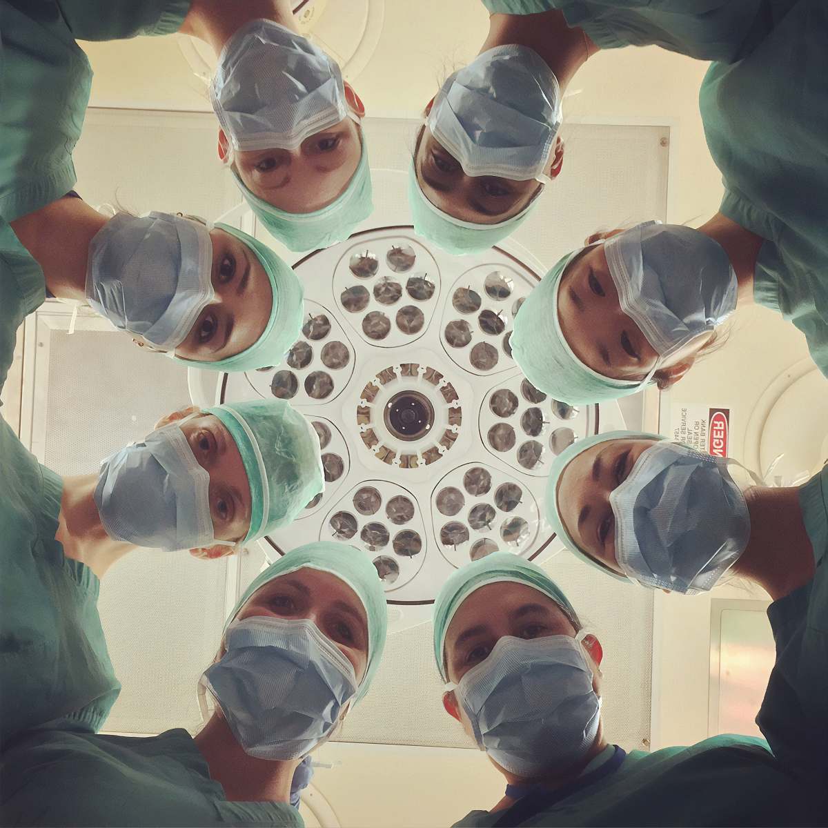 operating theatre people in white shirt holding clear drinking glasses clinic